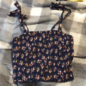 Stretchy crop top, very cute and comfy!! Straps are not adjustable,